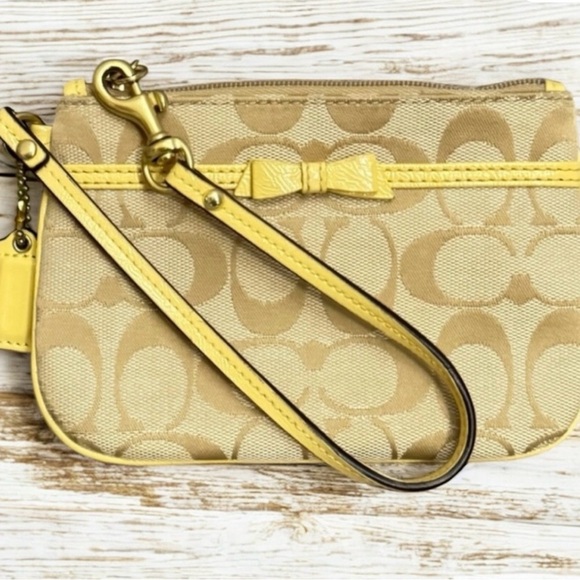 Coach NWOT Pastel Yellow Bow & Tan Wristlet - Picture 2 of 6